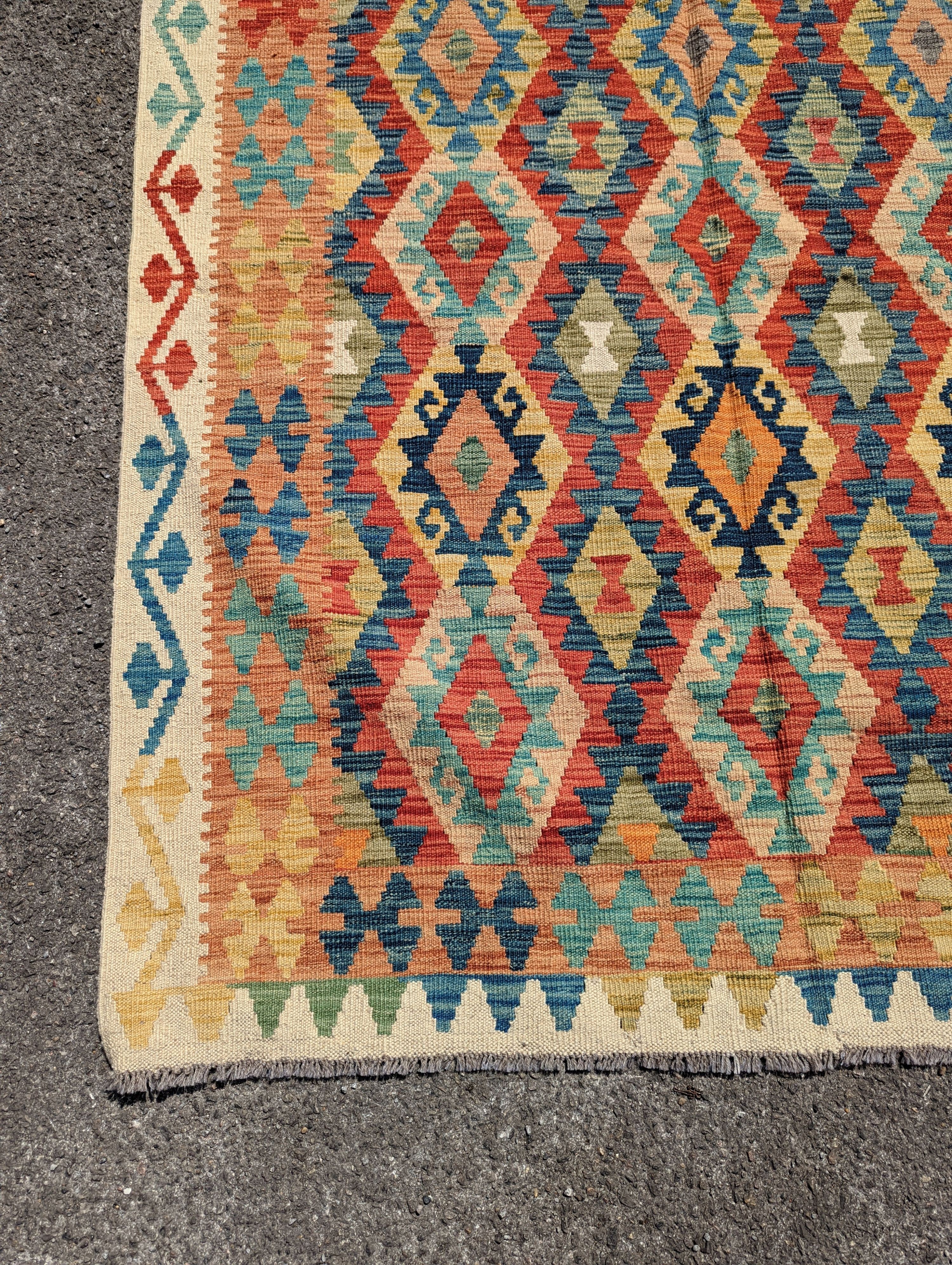 An Anatolian design polychrome geometric flatweave carpet, 196 x 156cm